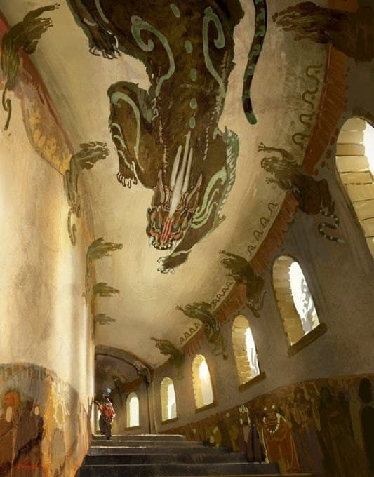 Warmly lit painted walls and arched windows inside a historic Pakistani monument.